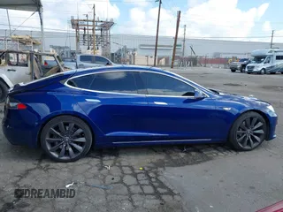 2016 Tesla Model S 90D with VIN 5YJSA1E22GF154873, listed as a IAAI auction lot 41950274 with 82,649 mi miles and . Bid and sale history available at DreamBid. Image 13.