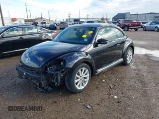 2018 Volkswagen Beetle S with VIN 3VWFD7ATXJM706338, listed as a IAAI auction lot 41293181 with 71,945 mi miles. Bid and sale history available at carsss.com. Image 2.
