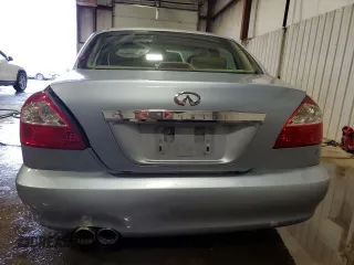 2002 Infiniti Q45 z VIN JNKBF01A62M002926, wystawiony jako Copart lot #73206924 z przebiegiem Nie podano mil oraz Szkody całkowita. Historia ofert i sprzedaży dostępna na DreamBid. Obrazek 6.