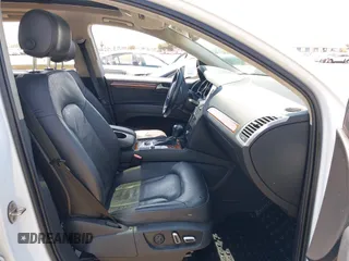 2014 Audi Q7 Premium Plus with VIN WA1LGAFE3ED021002, listed as a IAAI auction lot 42769562 with 82,118 mi miles and . Bid and sale history available at DreamBid. Image 5.