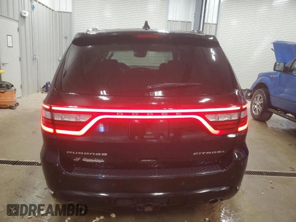 2018 Dodge Durango Citadel Anodized Platinum with VIN 1C4RDJEGXJC182877, listed as a Copart auction lot 83068134 with 84,545 mi miles and Salvage title. Bid and sale history available at DreamBid. Image 6.