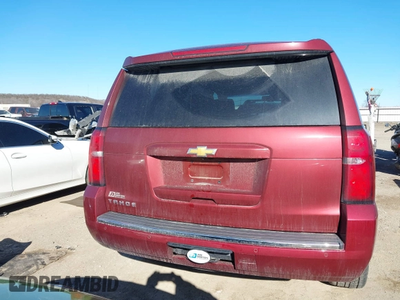 2016 Chevrolet Tahoe LTZ z VIN 1GNSKCKC9GR205745, wystawiony jako IAAI lot #41710241 z przebiegiem 94 931 mil mil oraz . Historia ofert i sprzedaży dostępna na DreamBid. Obrazek 16.