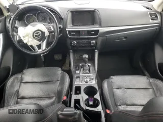 2016 Mazda CX-5 Grand Touring z VIN JM3KE4DY2G0637779, wystawiony jako Copart lot #52001805 z przebiegiem 184 381 mil mil oraz Czysty tytuł • Clean title. Historia ofert i sprzedaży dostępna na DreamBid. Obrazek 8.