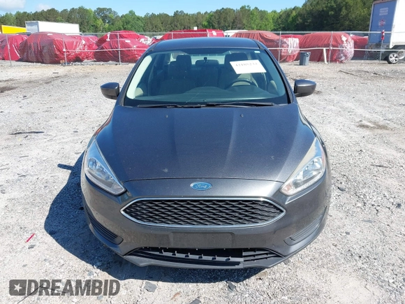 2018 Ford Focus SE z VIN 1FADP3FE1JL238012, wystawiony jako IAAI lot #42185232 z przebiegiem 143 687 mil mil oraz . Historia ofert i sprzedaży dostępna na DreamBid. Obrazek 12.