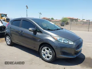 2015 Ford Fiesta SE z VIN 3FADP4EJ0FM146237, wystawiony jako IAAI lot #42452345 z przebiegiem 121 742 mil mil oraz . Historia ofert i sprzedaży dostępna na DreamBid. Obrazek 1.