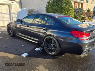 2016 BMW M6 z VIN WBS6E9C57GG437138, wystawiony jako Copart lot #45290525 z przebiegiem 58 645 mil mil oraz Tytuł czysty. Historia ofert i sprzedaży dostępna na DreamBid. Obrazek 3.