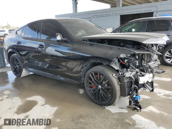 2023 BMW X6 M50i with VIN 5UXCY8C01P9S00552, listed as a Copart auction lot 84193154 with 16,590 mi miles and Salvage Title. Bid and sale history available at carsss.com. Image 4.