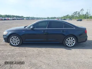 2015 Audi A6 3.0T Prestige with VIN WAUHGAFC3FN011654, listed as a IAAI auction lot 42104153 with 166,719 mi miles. Bid and sale history available at carsss.com. Image 14.