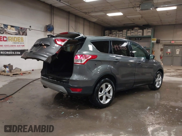 2014 Ford Escape SE with VIN 1FMCU9G9XEUD69423, listed as a IAAI auction lot 41908718 with 65,149 mi miles. Bid and sale history available at carsss.com. Image 4.