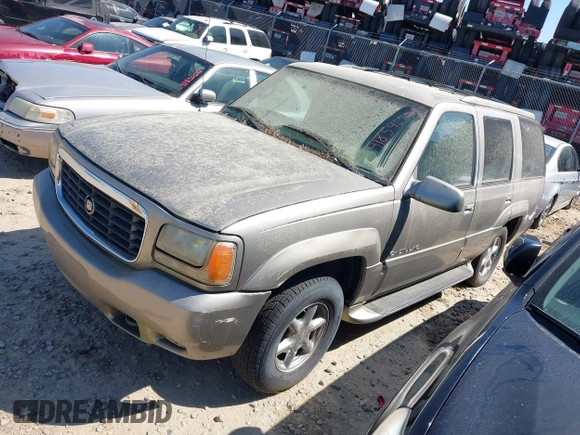 2000 Cadillac Escalade z VIN 1GYEK63R2YR209125, wystawiony jako IAAI lot #41854270 z przebiegiem 198 017 mil mil oraz . Historia ofert i sprzedaży dostępna na DreamBid. Obrazek 2.