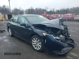 2020 Toyota Camry LE with VIN 4T1L11AK3LU977805, listed as a IAAI auction lot 41907558 with 82,237 mi miles and . Bid and sale history available at DreamBid. Image 1.