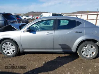 2014 Dodge Avenger SE with VIN 1C3CDZAB7EN144102, listed as a IAAI auction lot 41635691 with 201,428 mi miles and . Bid and sale history available at DreamBid. Image 14.