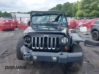 2012 Jeep Wrangler Unlimited Sport with VIN 1C4BJWDG8CL120308, listed as a IAAI auction lot 42365817 with 190,619 mi miles and . Bid and sale history available at DreamBid. Image 13.