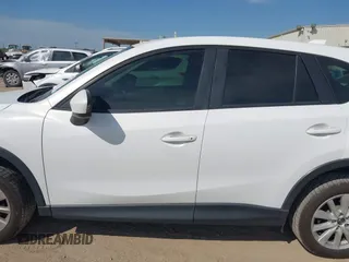 2013 Mazda CX-5 Sport z VIN JM3KE2BE5D0135213, wystawiony jako IAAI lot #42270730 z przebiegiem 140 917 mil mil oraz . Historia ofert i sprzedaży dostępna na DreamBid. Obrazek 14.