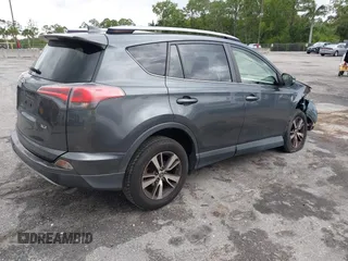 2017 Toyota RAV4 XLE with VIN JTMWFREVXHD096998, listed as a IAAI auction lot 41997925 with 119,564 mi miles and . Bid and sale history available at DreamBid. Image 4.