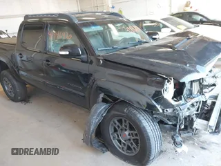 2014 Toyota Tacoma with VIN 3TMLU4EN6EM162605, listed as a IAAI auction lot 41446470 with 86,059 mi miles and . Bid and sale history available at DreamBid. Image 1.