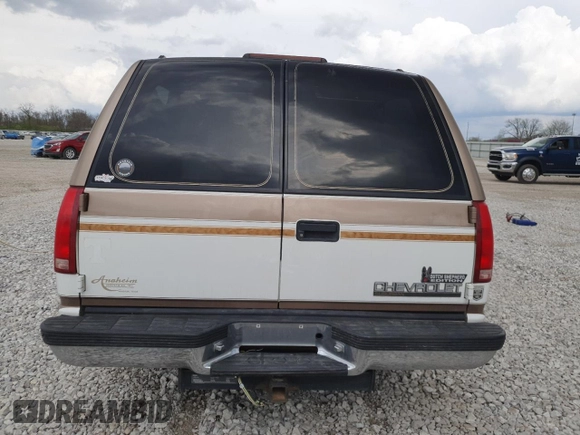 1999 Chevrolet Suburban with VIN 3GNEC16R9XG143471, listed as a Copart auction lot 53856565 with 208,621 mi miles and Salvage title. Bid and sale history available at DreamBid. Image 6.