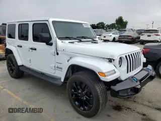 2023 Jeep Wrangler Sahara with VIN 1C4JJXP63PW536694, listed as a Copart auction lot 63409845 with 32,560 mi miles and Salvage title. Bid and sale history available at DreamBid. Image 4.
