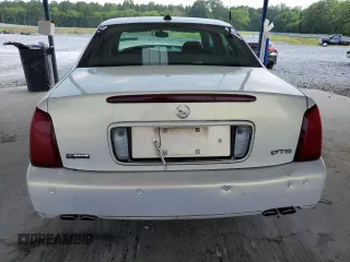 2004 Cadillac DeVille DTS z VIN 1G6KF57924U185324, wystawiony jako Copart lot #58222205 z przebiegiem 182 640 mil mil oraz Szkoda całkowita • Salvage title. Historia ofert i sprzedaży dostępna na DreamBid. Obrazek 6.