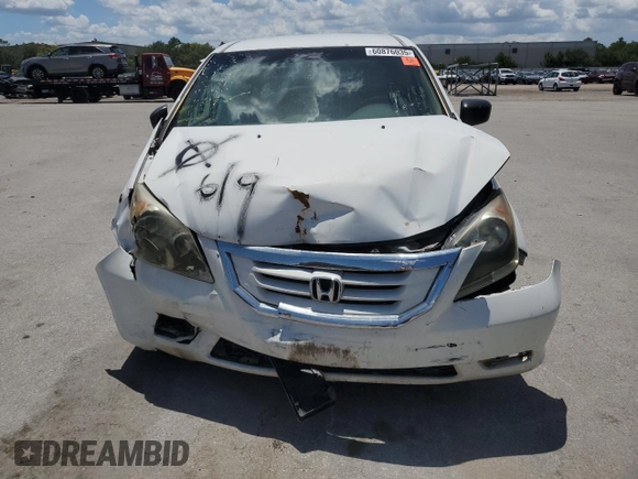 2010 Honda Odyssey LX with VIN 5FNRL3H23AB032112, listed as a Copart auction lot 60876035 with 223,335 mi miles and Salvage title. Bid and sale history available at DreamBid. Image 5.