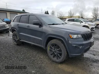 2018 Jeep Grand Cherokee Altitude with VIN 1C4RJFAG5JC219944, listed as a Copart auction lot 52030365 with 99,463 mi miles and Salvage title. Bid and sale history available at DreamBid. Image 4.