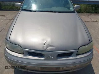 1998 Oldsmobile Cutlass GL z VIN 1G3NB52M8W6330343, wystawiony jako IAAI lot #42464937 z przebiegiem 146 023 mil mil oraz . Historia ofert i sprzedaży dostępna na DreamBid. Obrazek 6.