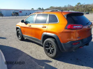 2014 Jeep Cherokee Trailhawk with VIN 1C4PJMBS4EW254879, listed as a IAAI auction lot 41550356 with 101,077 mi miles. Bid and sale history available at carsss.com. Image 3.