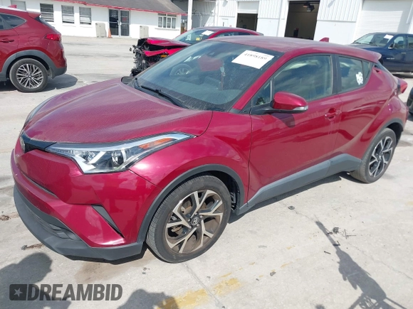 2019 Toyota C-HR XLE with VIN JTNKHMBX0K1017215, listed as a IAAI auction lot 41898189 with 74,239 mi miles. Bid and sale history available at carsss.com. Image 2.