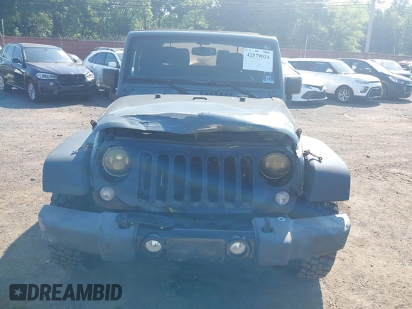 2015 Jeep Wrangler Freedom Edition with VIN 1C4AJWAG1FL714002, listed as a IAAI auction lot 42579024 with 98,732 mi miles and . Bid and sale history available at DreamBid. Image 12.