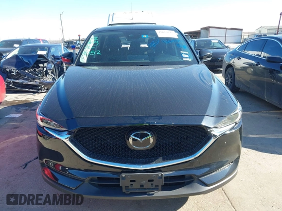 2021 Mazda CX-5 Grand Touring with VIN JM3KFADM1M0406098, listed as a IAAI auction lot 41654735 with 33,050 mi miles. Bid and sale history available at carsss.com. Image 12.