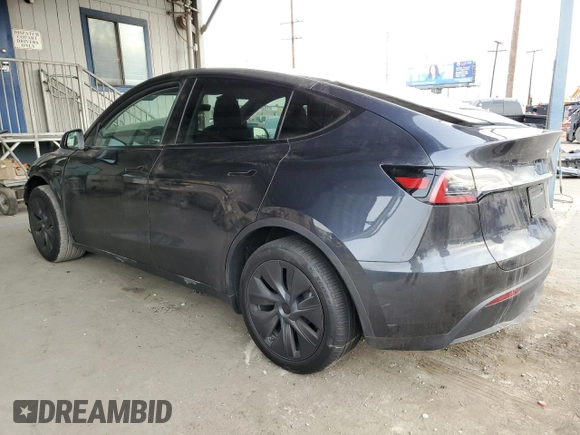 2025 Tesla Model Y Long Range with VIN 7SAYGDED8SF218700, listed as a Copart auction lot 84720474 with 1,832 mi miles and Salvage Title. Bid and sale history available at DreamBid. Image 2.