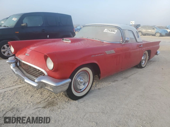 1957 Ford Thunderbird with VIN D7FH286272, listed as a Copart auction lot 77243694 with 19,878 mi miles and Salvage Title. Bid and sale history available at DreamBid. Image 1.