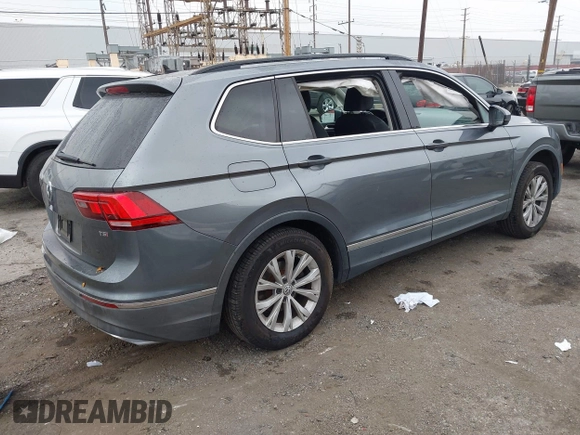 2018 Volkswagen Tiguan SEL z VIN 3VV3B7AX4JM005780, wystawiony jako IAAI lot #41880005 z przebiegiem 149 578 mil mil oraz . Historia ofert i sprzedaży dostępna na DreamBid. Obrazek 4.