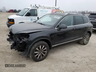 2011 Volkswagen Touareg Sport with VIN WVGFF9BP3BD000721, listed as a Copart auction lot 45039945 with 163,824 mi miles and Salvage Title. Bid and sale history available at DreamBid. Image 1.