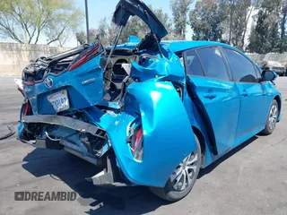 2021 Toyota Prius LE with VIN JTDKAMFP7M3169633, listed as a IAAI auction lot 41986170 with 55,925 mi miles and . Bid and sale history available at DreamBid. Image 4.