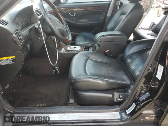 2003 Hyundai XG z VIN KMHFU45E63A237497, wystawiony jako Copart lot #74299524 z przebiegiem Nie podano mil oraz Szkody całkowita. Historia ofert i sprzedaży dostępna na DreamBid. Obrazek 7.