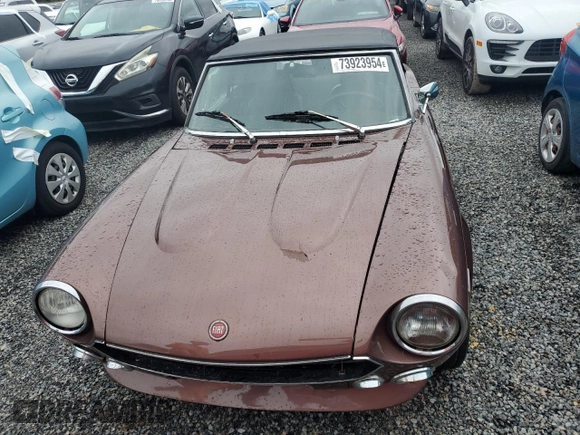 1979 FIAT 124 Spider z VIN 124CS20146682, wystawiony jako Copart lot #73923954 z przebiegiem 83 258 mil mil oraz Szkoda całkowita • Salvage title. Historia ofert i sprzedaży dostępna na DreamBid. Obrazek 5.