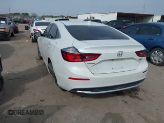 2020 Honda Insight Touring with VIN 19XZE4F90LE009301, listed as a IAAI auction lot 41661665 with 73,673 mi miles and . Bid and sale history available at carsss.com. Image 3.