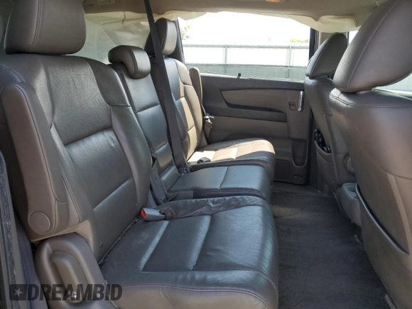 2014 Honda Odyssey Touring with VIN 5FNRL5H93EB061754, listed as a Copart auction lot 55182015 with 168,058 mi miles and Salvage title. Bid and sale history available at DreamBid. Image 11.