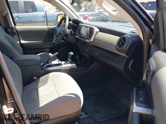 2023 Toyota Tacoma SR with VIN 3TMCZ5AN1PM654572, listed as a IAAI auction lot 42312575 with 14,111 mi miles and . Bid and sale history available at DreamBid. Image 5.