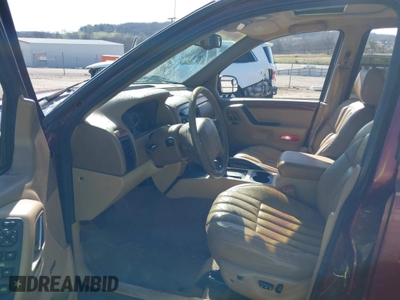 1999 Jeep Grand Cherokee Limited with VIN 1J4GW68N3XC770468, listed as a IAAI auction lot 41793600 with 65,277 mi miles. Bid and sale history available at carsss.com. Image 5.