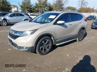 2017 Honda CR-V Touring with VIN 5J6RW2H94HL013536, listed as a IAAI auction lot 41577317 with 97,132 mi miles. Bid and sale history available at carsss.com. Image 2.