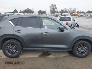 2021 Mazda CX-5 Touring with VIN JM3KFACM6M0480487, listed as a IAAI auction lot 41731646 with 26,951 mi miles and . Bid and sale history available at carsss.com. Image 14.