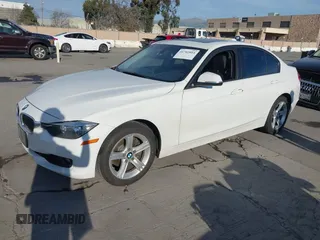 2013 BMW 3 Series 328i xDrive with VIN WBA3B5G54DNP40324, listed as a IAAI auction lot 41702014 with 126,932 mi miles. Bid and sale history available at carsss.com. Image 2.