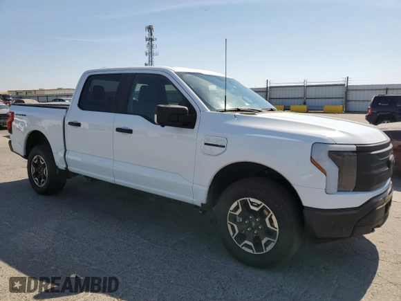 2023 Ford F-150 Lightning Pro with VIN 1FT6W1EVXPWG44972, listed as a Copart auction lot 60303485 with 19,788 mi miles and Salvage title. Bid and sale history available at DreamBid. Image 4.