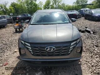 2023 Hyundai Tucson SEL z VIN 5NMJBCAE1PH272772, wystawiony jako Copart lot #56799805 z przebiegiem 20 041 mil mil oraz Szkoda całkowita • Salvage title. Historia ofert i sprzedaży dostępna na DreamBid. Obrazek 5.