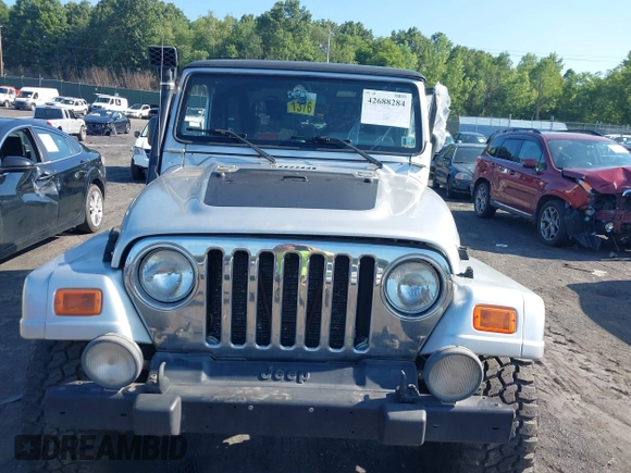 2005 Jeep Wrangler Unlimited with VIN 1J4FA44S55P352803, listed as a IAAI auction lot 42688284 with 128,586 mi miles and . Bid and sale history available at DreamBid. Image 12.