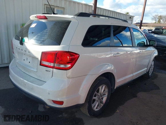2014 Dodge Journey SXT with VIN 3C4PDCBGXET122969, listed as a IAAI auction lot 41741679 with 151,285 mi miles. Bid and sale history available at carsss.com. Image 4.