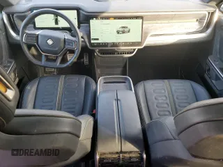 2023 Rivian R1T Adventure with VIN 7FCTGAAA2PN017170, listed as a Copart auction lot 77473014 with 28,821 mi miles and Salvage Title. Bid and sale history available at DreamBid. Image 8.