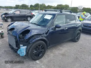 2013 MINI Countryman with VIN WMWZB3C58DWM07817, listed as a IAAI auction lot 41962291 with 60,763 mi miles and . Bid and sale history available at DreamBid. Image 2.
